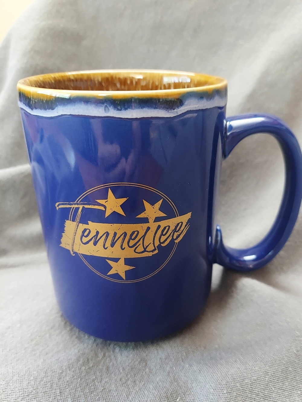 Tennessee Ceramic Coffee Mug in Blue And Gold Tone brown drip glaze On Inside
